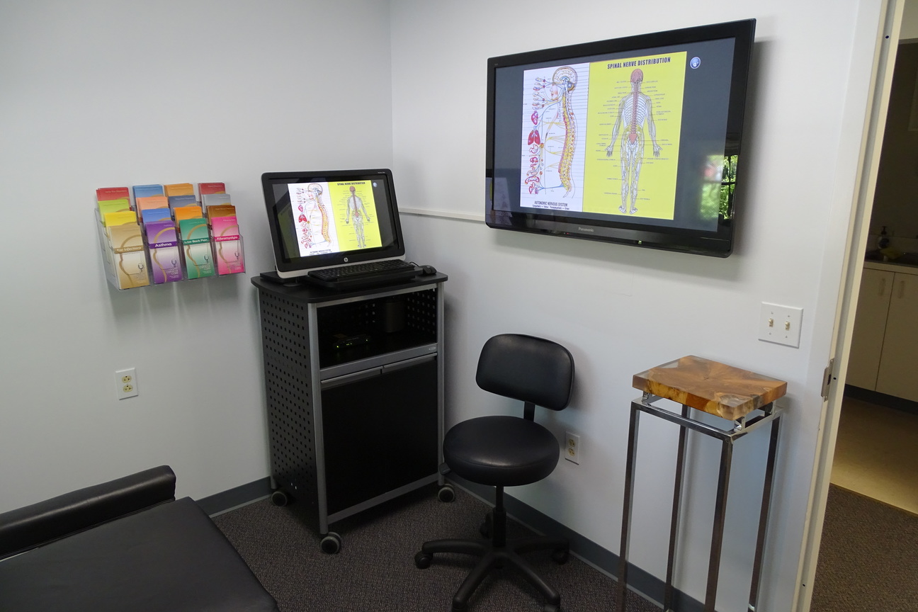 room with monitor with educational diagrams
